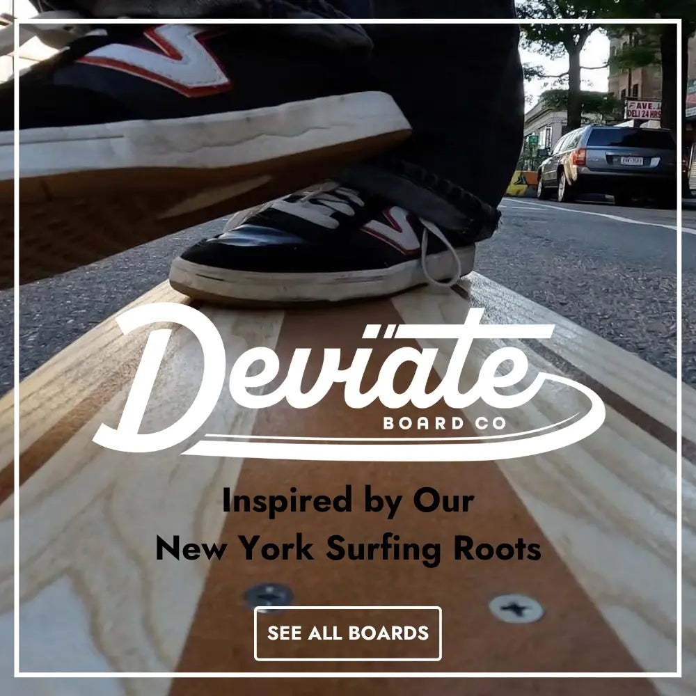 Skate cross stepping on a Deviate L-Train longboard along a Brooklyn street.